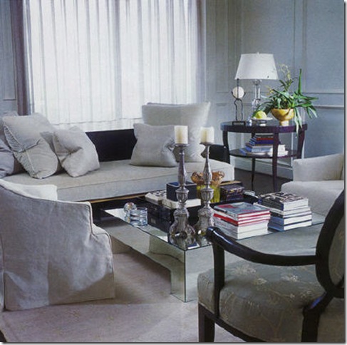 The bedroom features a Baker four poster bed and Barbara Barry end